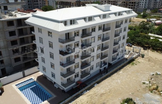 Новые дуплексы 2+1 с видом на горы в ЖК с инфраструктурой в Махмутларе, 95 м2 в Турции - фото 9