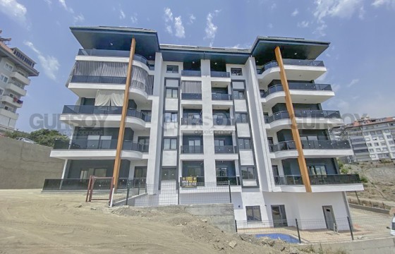 Просторная квартира с чистовой отделкой, в комфортабельном жилом комплексе, с бассейном и садом в Турции - фото 9