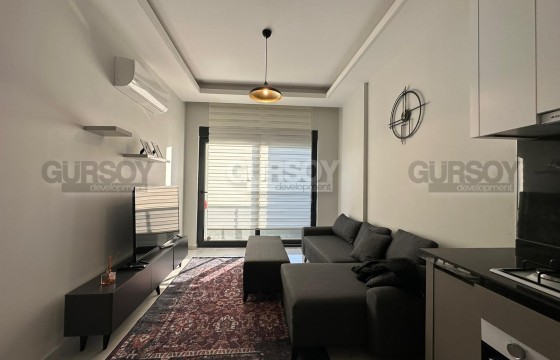 Квартира с современным дизайном, комфортабельной мебелью и новой бытовой техникой, на 2-м этаже, в районе Нижняя Оба в Турции - фото 1