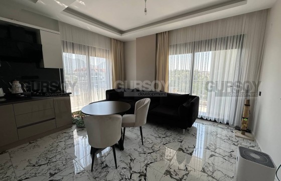 Новая квартира с современным дизайном, комфортабельной мебелью и полным набором бытовой техники, в километре от моря в Турции - фото 12