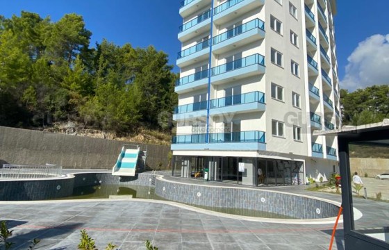 Бюджетная квартира в новом комплексе в районе Авсаллар в Турции - фото 4