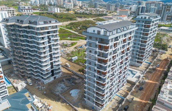 Чудесная квартира в комплексе на стадии завершения строительства, район Махмутлар в Турции - фото 1