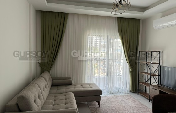 Аренда квартиры 1+1 в Махмутларе: комфорт и удобство на берегу моря в Турции - фото 1