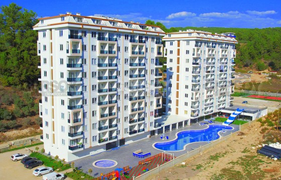 Бюджетная двухкомнатная квартира в комплексе с шикарной инфраструктурой в Турции - фото 11