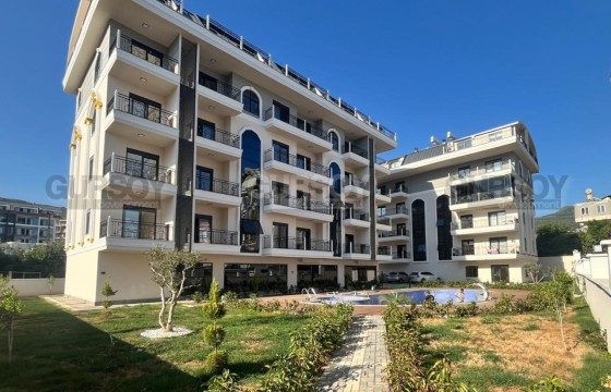 Светлая квартира с одной спальней, с чистовой отделкой в новой резиденции в районе Оба в Турции - фото 4