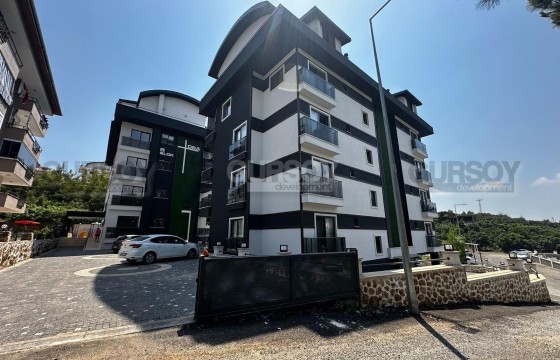 Светлая квартира 1+1 в современном комплексе в живописном районе Оба по выгодной цене в Турции - фото 3