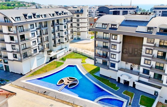 Квартира в новом жилом комплексе недалеко от моря, район Карыгджак в Турции - фото 10