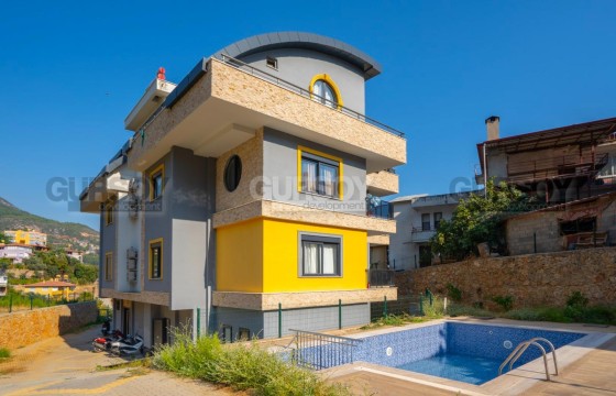 Квартира 1+1 с мебелью и бытовой техникой в живописном открытом районе центра Алании. в Турции - фото 12