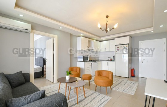 Светлая квартира 1+1 с мебелью и техникой в районе пляжа Клеопатра в Турции - фото 10