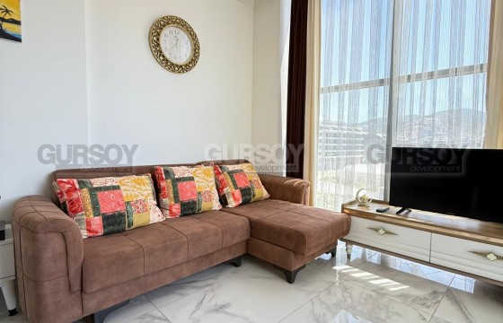 Квартира 1+1 с панорамным видом на море на первой линии в Каргыджаке в Турции - фото 1