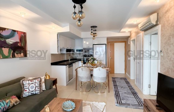 Квартира 1+1 с панорамным видом в районе Джикджилли в Турции - фото 1