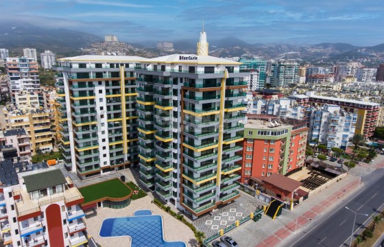 Квартира 1+1 с мебелью в Махмутларе на первой береговой линии в Турции - фото 1