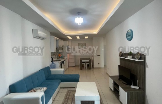 Меблированная квартира 1+1 в районе Тосмур, подходящая для ВНЖ в Турции - фото 11