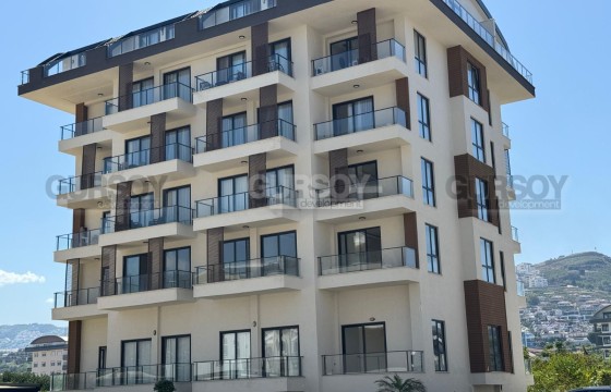 Квартира 1+1 с полной инфраструктурой в 200 метрах от моря, Каргыджак в Турции - фото 6