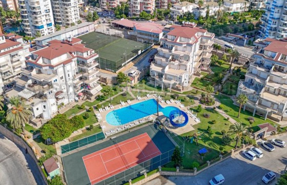 Просторная двухкомнатная квартира с выходом в сад в Турции - фото 3