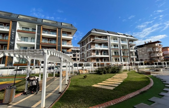 Квартира 1+1 в современном комплексе в районе Клеопатры в Турции - фото 3