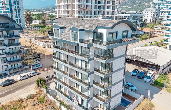 Современная квартира 1+1 рядом с морем и всей инфраструктурой в Турции - фото 11