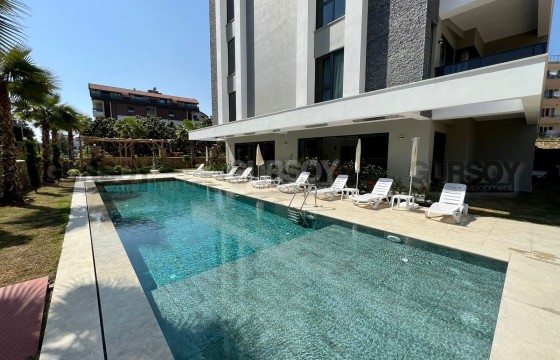 Современная 1+1 в доме с инфраструктурой в Турции - фото 11