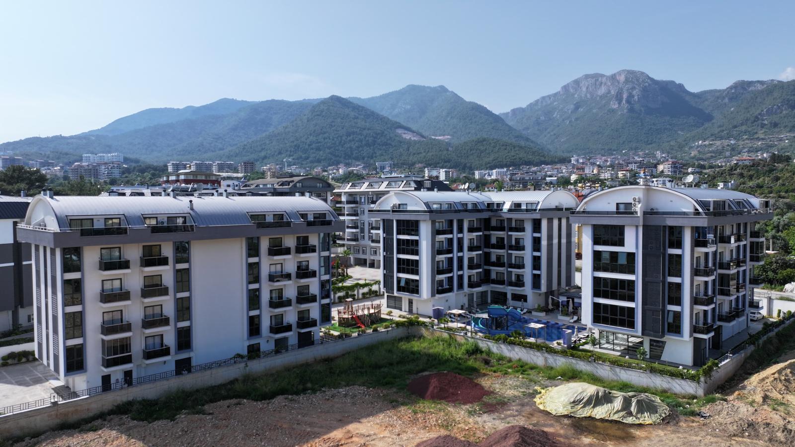 Инвестиционная квартира в комплексе с хорошей инфраструктурой по низкой цене в Турции - фото 2