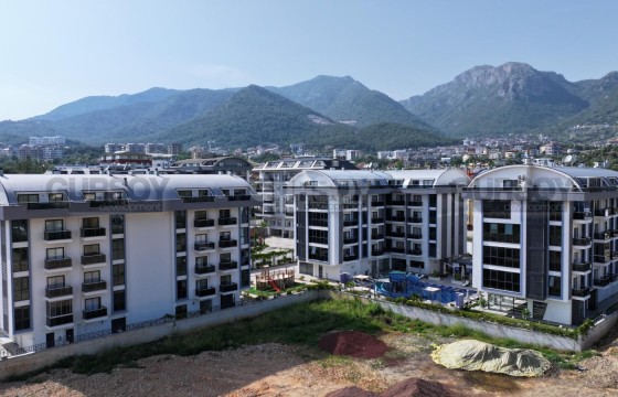 Инвестиционная квартира в комплексе с хорошей инфраструктурой по низкой цене в Турции - фото 6