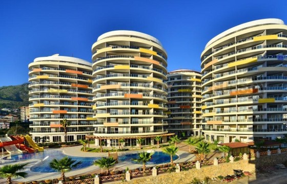 Уютная и светлая квартира 1+1 в шаговой доступности до моря, Джикджилли в Турции - фото 1