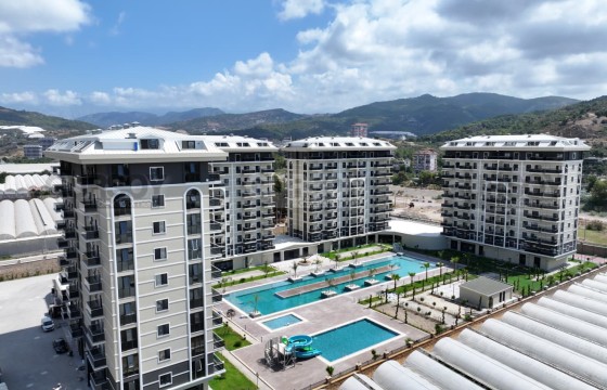 Просторная квартира 1+1 в современном жилом комплексе в Турции - фото 5