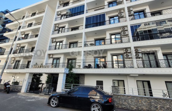 Современная и стильная квартира 1+1 в районе Махмутлар в Турции - фото 1