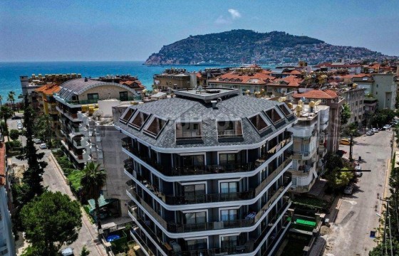 Квартира с мебелью 1+1 в центре Алании в новом доме, только 100 м до моря в Турции - фото 1