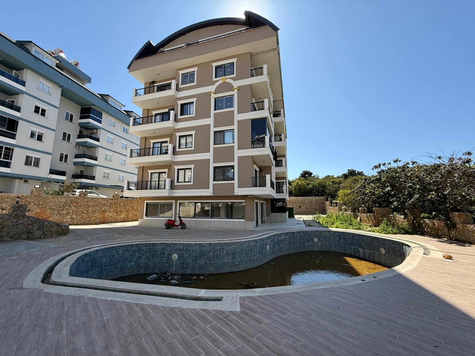 Новая квартира планировкой 2+1 в престижном районе Оба в Турции - фото 4