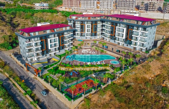 Апартаменты 1+1, 2+1, 3+1, 4+1 в новом престижном комплексе в районе Кестель в Турции - фото 5