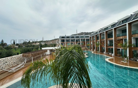 Уютная квартира 2+1 с собственным садом в районе Конаклы в Турции - фото 12