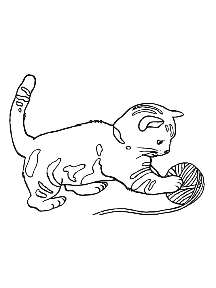 Котенок играет с нитками